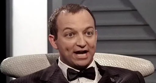 A still from the movie "Starship Troopers" of the funny brain bug sceptic while he is saying "Frankly I find the idea of a bug that thinks offensive!"
